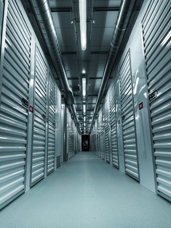 Hallway of metal storage units 600 Unsplash