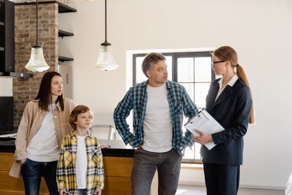 A man talking to the agent 600 Pexels