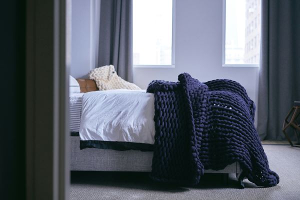 Bed with a blanket Unsplash