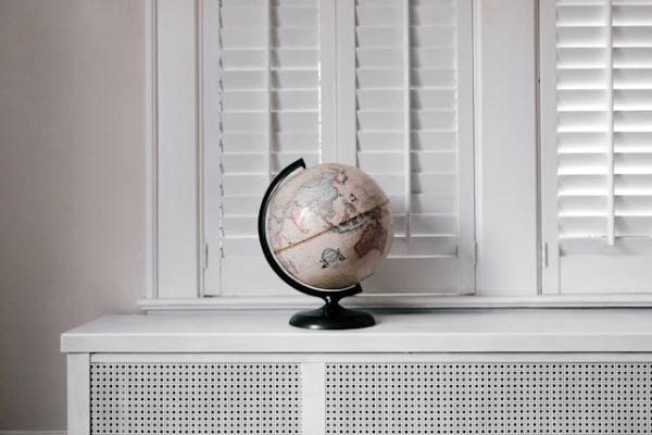 Beige globe on white desk 600 Unsplash