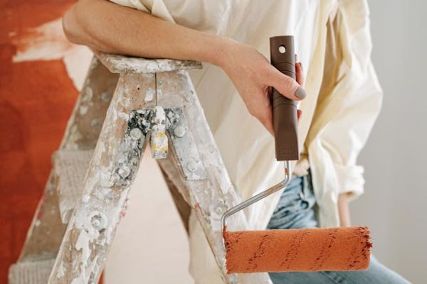 Close up of person holding a paint roller 600 Pexels