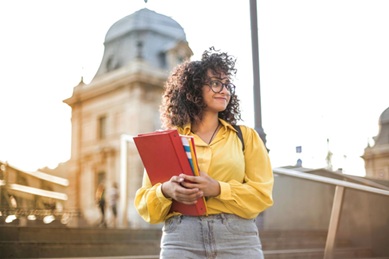 Girl in front of university small image Pexels