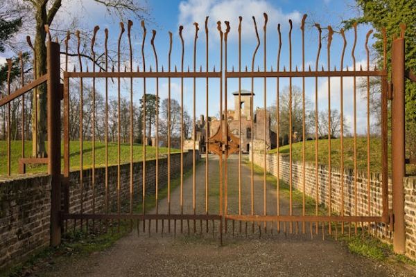 Historic Castle Behind Iron Gate on Sunny Day 600 Pexels