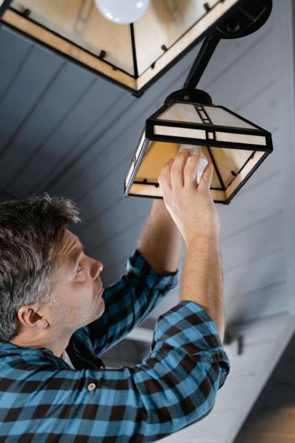 Man holding a lightbulb Pexels