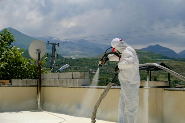 Man spraying water on roof 600 Unsplash
