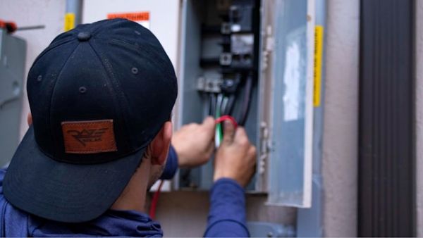 Man working on solar panel 600 Unsplash