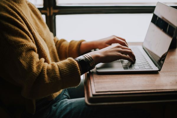 Person sitting at laptop 600 Unsplash