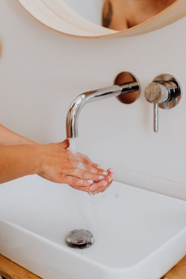 Person washing hands 600 Pexels