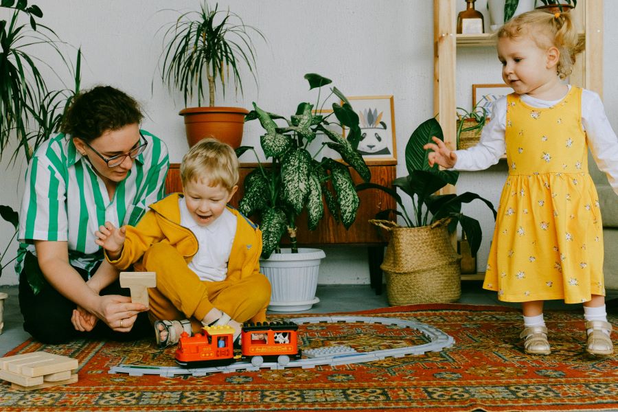 Playing with toy train Pexels