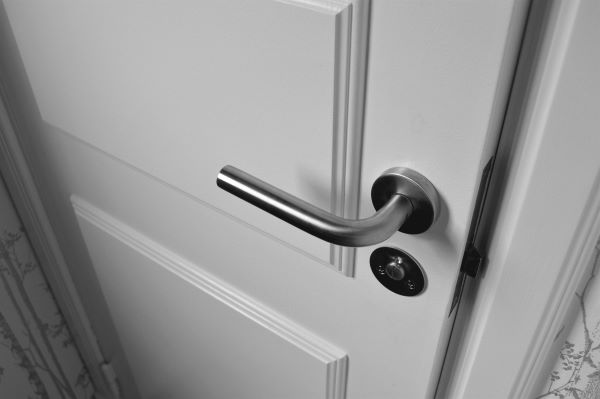 Semi open white door 600 Pexels