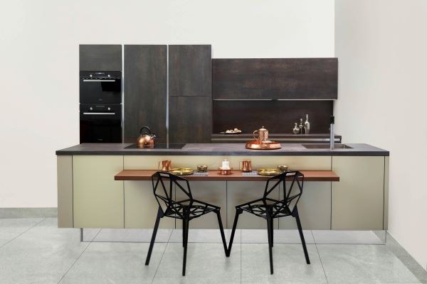 Two black chairs in kitchen Pexels