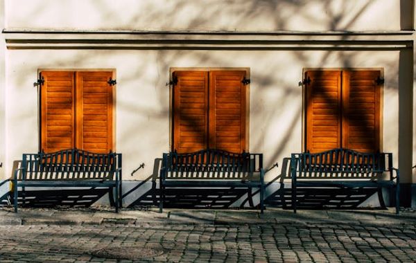 Urban scene with three wooden shutters 600 Pexels