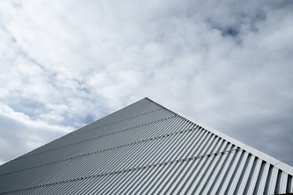 White building under white clouds during day 600 Unsplash
