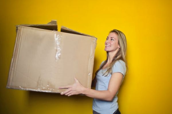 Woman carrying a box 600 Pexels