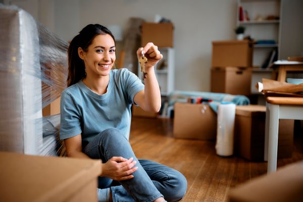 Woman holding a key NoBS