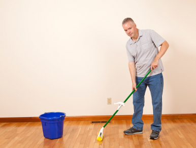 man cleaning the home