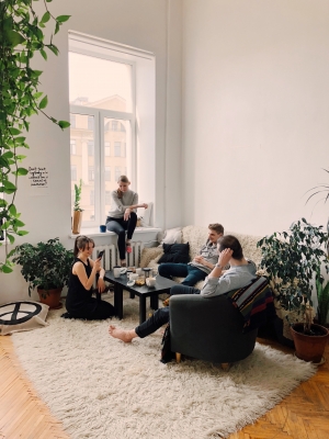 friends in living room having a converstation